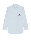 Jw Anderson Light Blue Shirt With Classic Collar And Embroidery Detail On Front And Cuff In Light Blue
