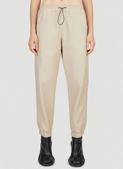 Jw Anderson Women Tapered Track Pants In Neutral