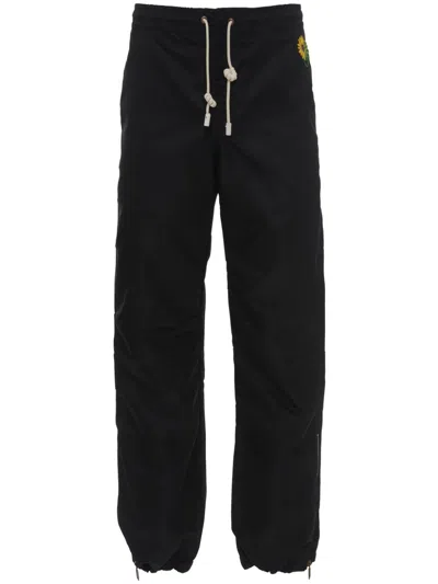 Jw Anderson Zip-cuff Trousers In Black