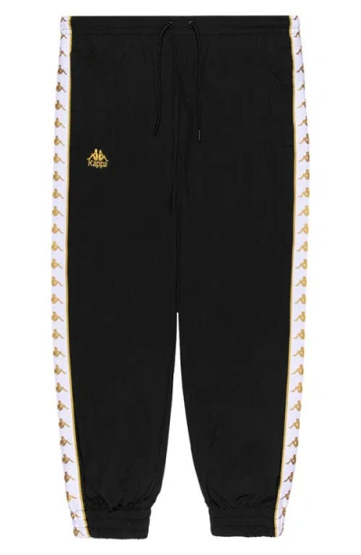 Kappa 222 Banda Neldo Woven Nylon Joggers In Black-yellow Gold Rich-white