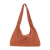 Kara Armpit Bag. In Orange