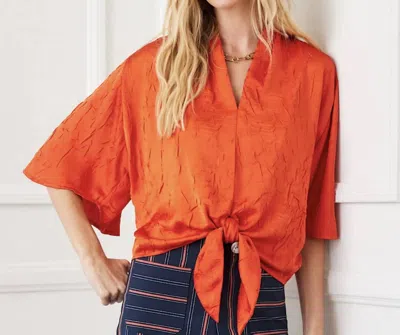 KAREN KANE FLARE SLEEVE TIE FRONT TOP IN ORANGE