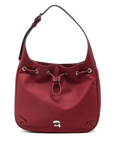 Karl Lagerfeld Drawstring Logo-patch Shoulder Bag In Red