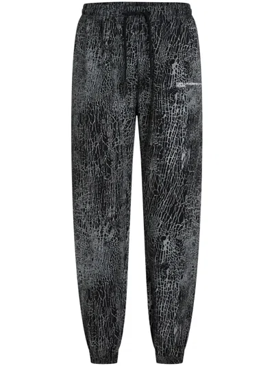 Karl Lagerfeld Jeans Embroidered Cracked-print Track Pants In Black
