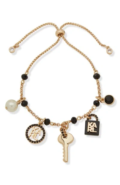 Karl Lagerfeld Lock And Key Enamel, Crystal & Imitation Pearl Logo Charm Slider Bracelet In Gold