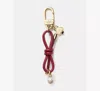 Kate Spade Bow Faux Pearl Bag Charm In Gold