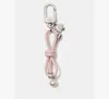 Kate Spade Bow Faux Pearl Bag Charm In Pink