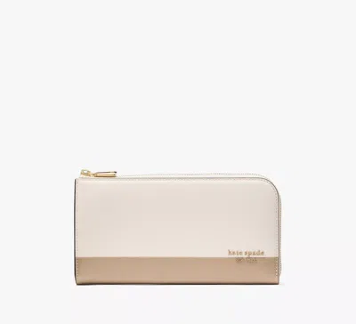 Kate Spade Devin Colorblocked Zip Around Continental Wallet In Brown