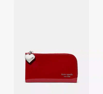 Kate Spade Devin Patent Bifold Wallet In Red