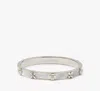 Kate Spade Heritage Bloom Hinged Bangle In Cream/silver
