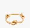 Kate Spade New York Interlock Bangle Bracelet In Gold
