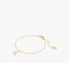 Shop Kate Spade Initial Script Bracelet In Gold