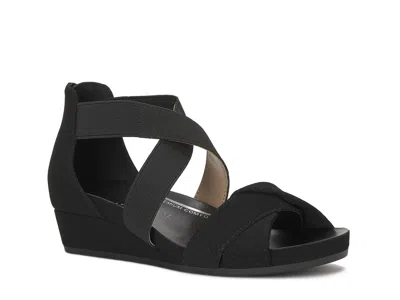 Kelly & Katie Nichelle Wedge Sandal In Black
