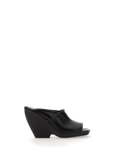 Khaite Aimee Ankle Strap Flat Sandal In Leather In Black
