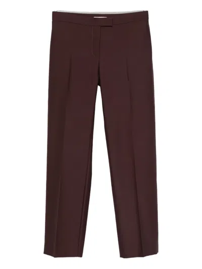 Khaite Callen Pleated-front Trousers In Brown