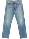Khaite Relaxed Bow Leg Jeans In Faded Denim In Blue