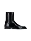Khaite Glossy Enameled Leather Boot In Black