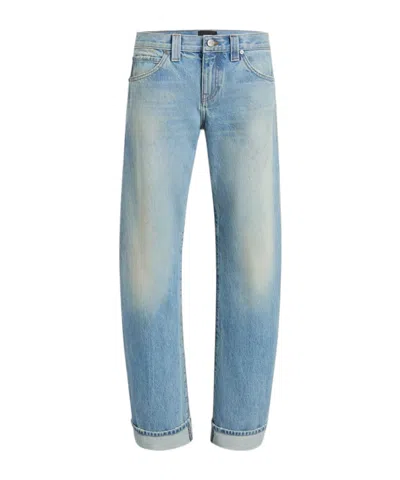 Khaite Karo Low-rise Curved Leg Jeans In Blue