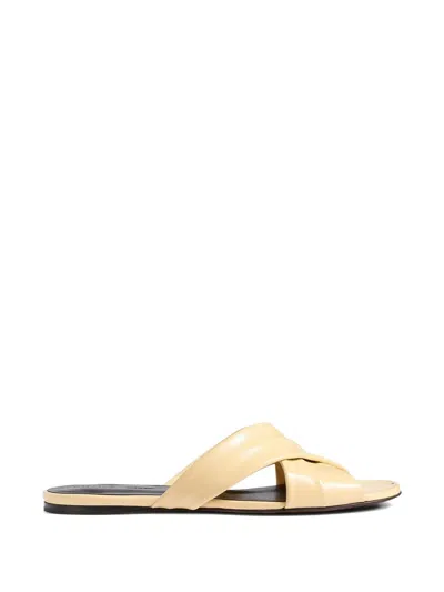 Khaite Liria Crossover Leather Sandals In Yellow