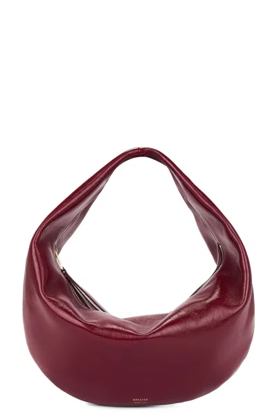 Khaite Olivia Patent Hobo Bag In Oxblood