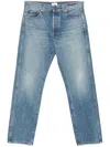Khaite Relaxed Bow Leg Jeans In Faded Denim In Blue