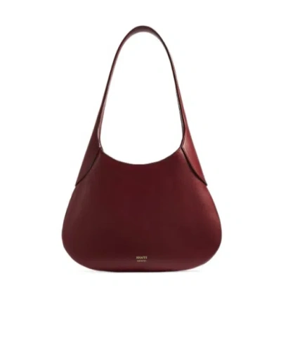 Khaite Soft Crescent-shaped Bag In Red