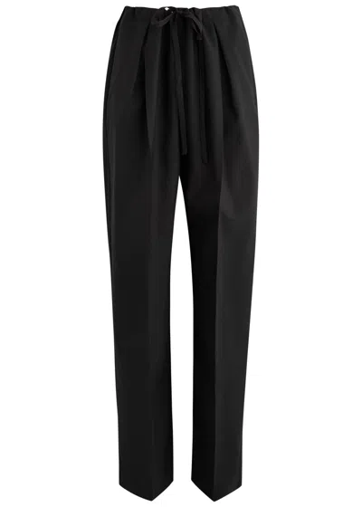 KHAITE KHAITE TRENTON TAPERED-LEG WOOL TROUSERS