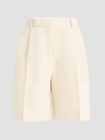 Khaite Auggie Pleated Wool And Silk-blend Shorts In Neutral