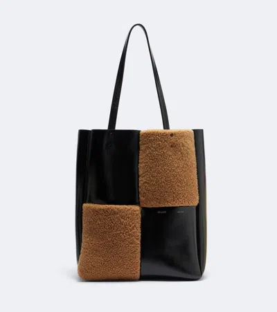 Khaite Zoe Medium Shearling Paneled Tote Bag In Black