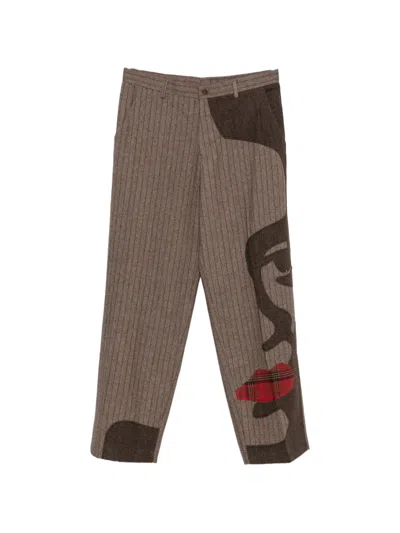 Kidsuper Pinstripe Face-patchwork Trousers In Brown
