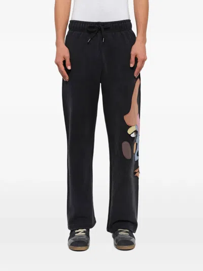 Kidsuper Side Eye Face Elasticated Track Pants In Black