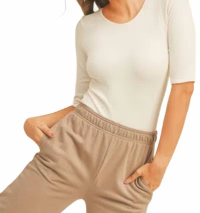 Kimberly C Short Sleeve Ribbed Bodysuit In Cream In White