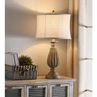 Kirkland's Distressed Brown Spindle Table Lamp