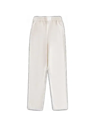 Kith Ida Autograph Monogram-print Trousers In Neutral