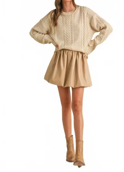 KLESIS FAUX LEATHER BUBBLE MINI SKIRT IN BEIGE