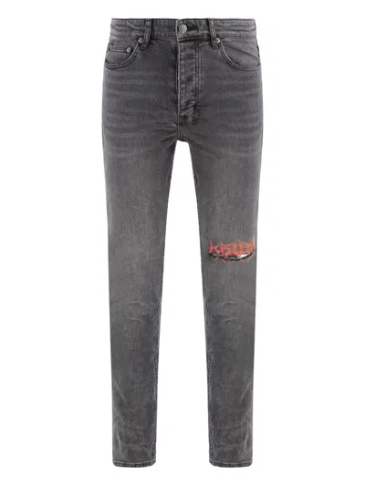 KSUBI DISTRESSED-EFFECT JEANS