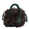 Kurt Geiger Plush Brown Clutch With Green Netted Cord Design And Gold Emblem In Brown