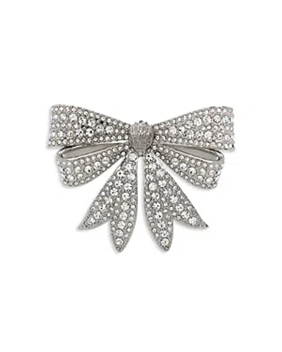 Kurt Geiger Pave Eagle Head Bow Pin In Rhodium Plated In Metallic