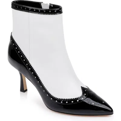 L Agence L'agence Ember Wingtip Pointed Toe Bootie In Black/white