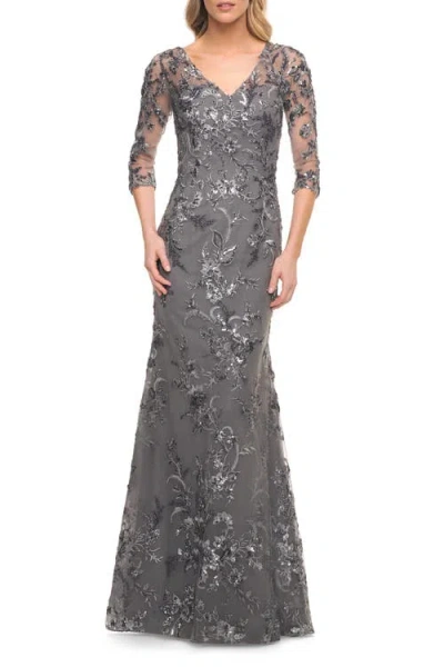 La Femme Exquisite Lace Beaded Long Gown With Sheer Sleeves In Gray