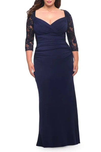 La Femme Jersey Plus Dress With Lace Sleeves And Back In Blue