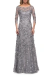 La Femme Lace Gown With Full Skirt And Sheer Lace Sleeves In Silver