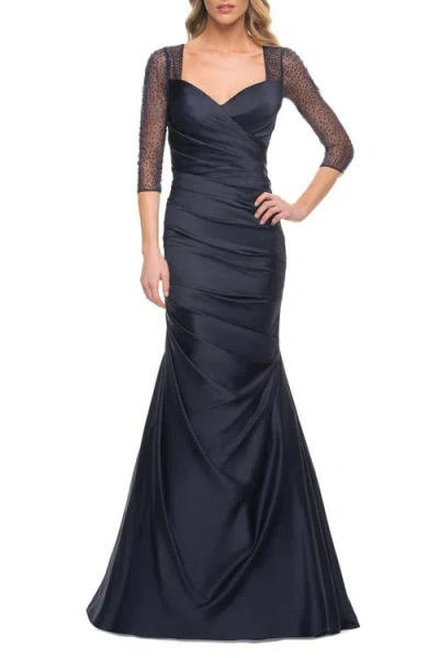 LA FEMME LA FEMME MERMAID SATIN PLEATED GOWN WITH ILLUSION BEADED SLEEVES