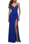 La Femme Net Jersey Long Ruched Gown With Slit And Open Back In Royal Blue