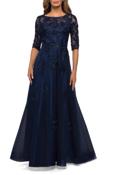 LA FEMME LA FEMME THREE QUARTER SLEEVE A-LINE GOWN WITH FLORAL EMBELLISHMENTS