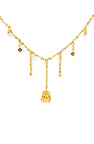 La Meno Beetle Glow Necklace In Gold