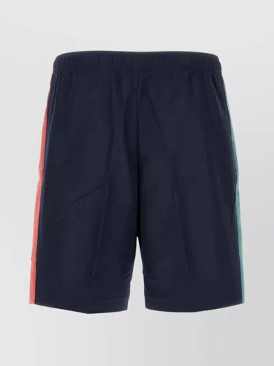 Lacoste Bermuda Shorts With Central Pleats And Side Stripes In Blue