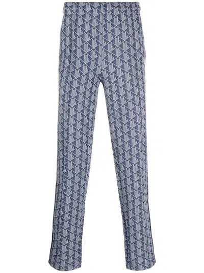 Lacoste Jacquard Monogram-pattern Track Pants In Blue