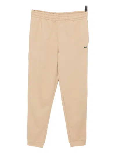 Lacoste Logo-embroidered Trousers In Neutral