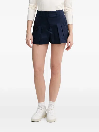 Lacoste Pleated Logo-patch Shorts In Blue
